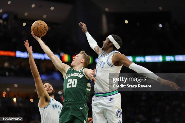 Green of the Milwaukee Bucks shoots over Kyle Anderson of the Minnesota Timberwolves during the second half of a game at Fiserv Forum on February 08,...