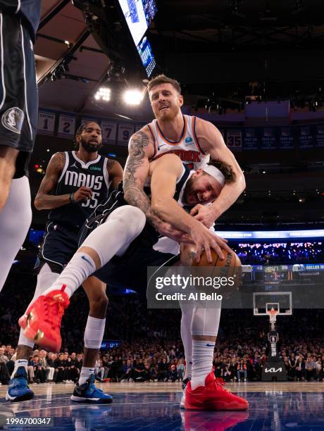 Isaiah Hartenstein of the New York Knicks foul Luka Doncic of the Dallas Mavericks during their game at Madison Square Garden on February 08, 2024 in...