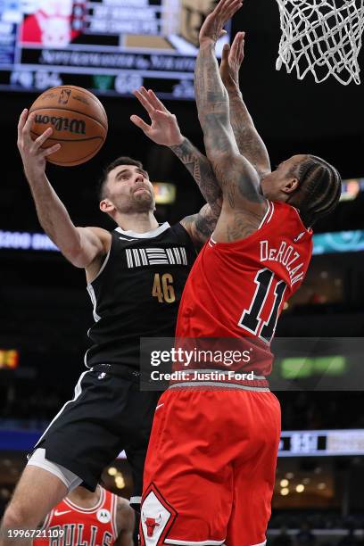 John Konchar of the Memphis Grizzlies goes to the basket against DeMar DeRozan of the Chicago Bulls during the second half at FedExForum on February...