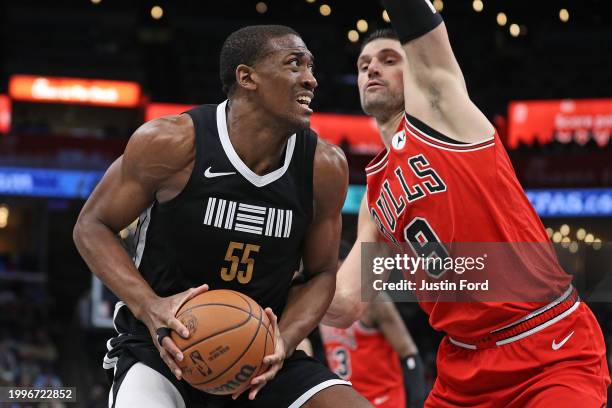 Trey Jemison of the Memphis Grizzlies handles the ball against Nikola Vucevic of the Chicago Bulls during the second half at FedExForum on February...