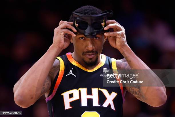 Bradley Beal of the Phoenix Suns adjusts his face mask during the second half against the Utah Jazz at Footprint Center on February 08, 2024 in...