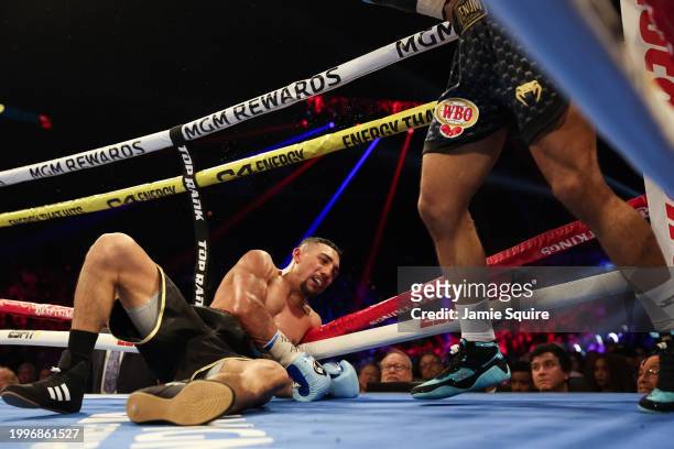 Teofimo Lopez is knocked down by Jamaine Ortiz for the WBO junior welterweight title at Michelob ULTRA Arena on February 08, 2024 in Las Vegas,...