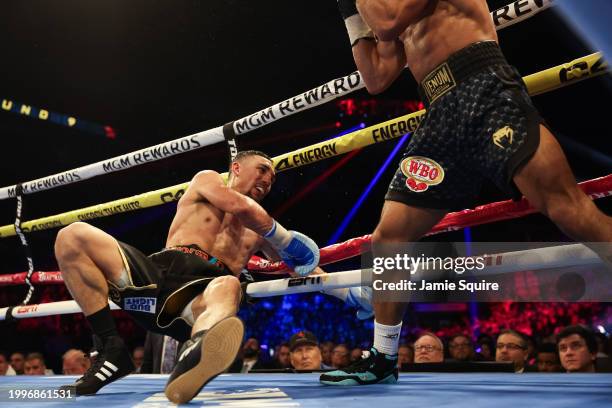 Teofimo Lopez is knocked down by Jamaine Ortiz for the WBO junior welterweight title at Michelob ULTRA Arena on February 08, 2024 in Las Vegas,...