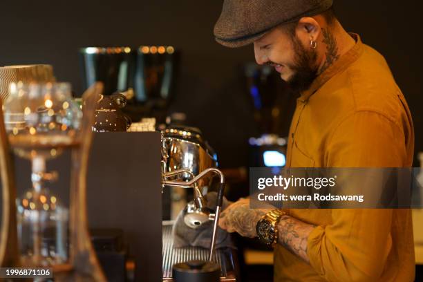 hipster barista brewing coffee with espresso maker - barista stock pictures, royalty-free photos & images