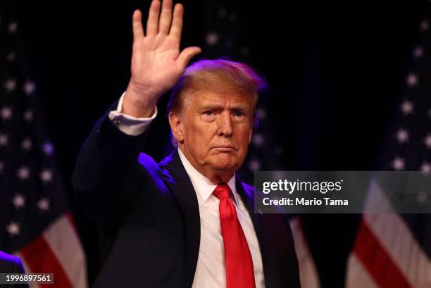 Republican presidential candidate and former U.S. President Donald Trump greets supporters during his caucus night watch party at the Treasure Island...