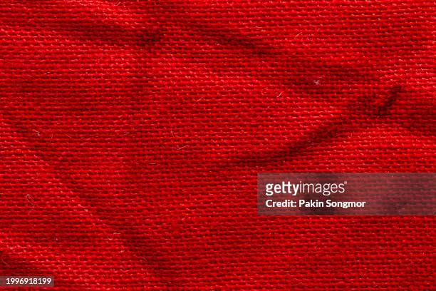 red sackcloth texture and textile background with full frame. - patches stockfoto's en -beelden