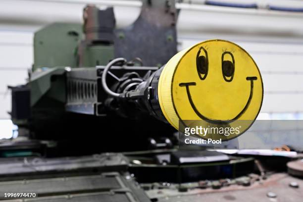 View of a Puma fighting vehicle's cannon at a production line as German Chancellor Olaf Scholz and Defence Minister Boris Pistorius attend the...