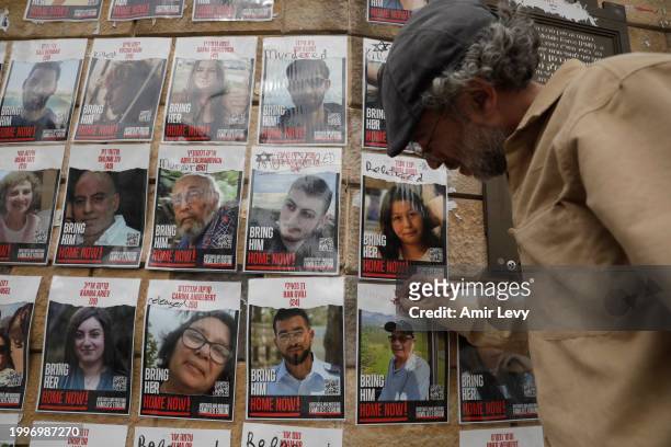 Man writes released on a poster of missing Israeli, Louis Har on a wall at Hostages Square on February 12, 2024 in Tel Aviv, Israel. The Israeli...