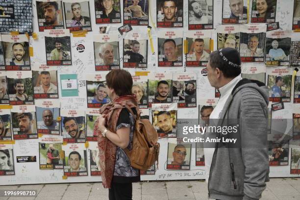 People view posters of missing Israelis on a wall at Hostages Square on February 12, 2024 in Tel Aviv, Israel. The Israeli military says it has...