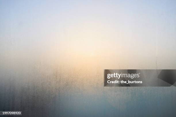 full frame shot of glass pane with dew, condensation on glass window - bagnato foto e immagini stock