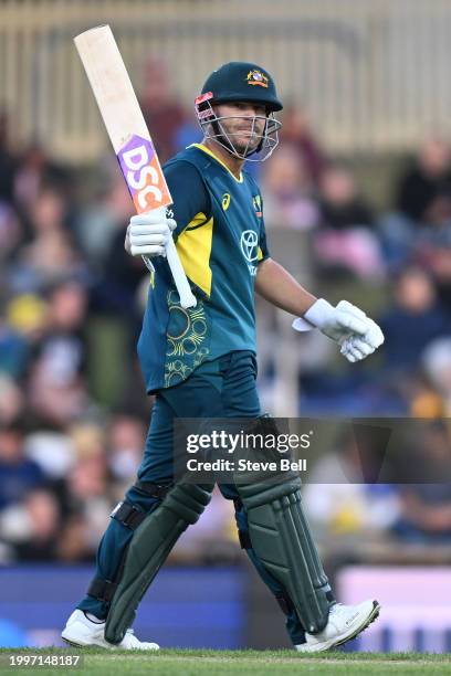 David Warner of Australia celebrates scoring a half century during game one of the Men's T20 International series between Australia and West Indies...