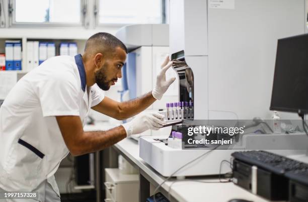 scientist working in the laboratory - microbiologist stock pictures, royalty-free photos & images