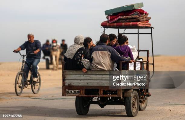 Palestinian families are fleeing Rafah on the southern Gaza Strip, taking the coastal road toward Deir Al-Balah in the central Gaza Strip, on...