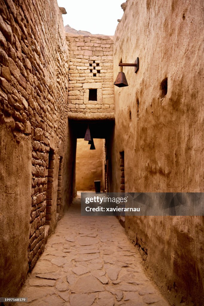 Open air pathway between mudbrick buildings, Al-Ula old town