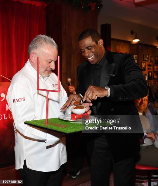 Chef Dino Gatto presents Deion Sanders with a RAO's meatball during RAO's Gridiron Club Prime Night Hosted By Deion Sanders at Paris Las Vegas on...