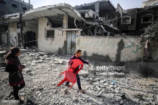 Palestinians are inspecting the damage caused by Israeli bombardment in Deir al-Balah, central Gaza Strip, on February 12 as battles are continuing...