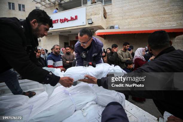 Palestinians are mourning their relatives, who were killed in an overnight Israeli strike on Deir al-Balah, during a mass funeral at the Al-Aqsa...