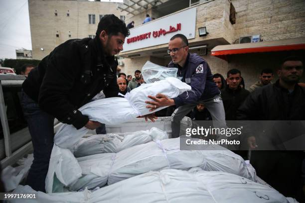 Palestinians are mourning their relatives, who were killed in an overnight Israeli strike on Deir al-Balah, during a mass funeral at the Al-Aqsa...