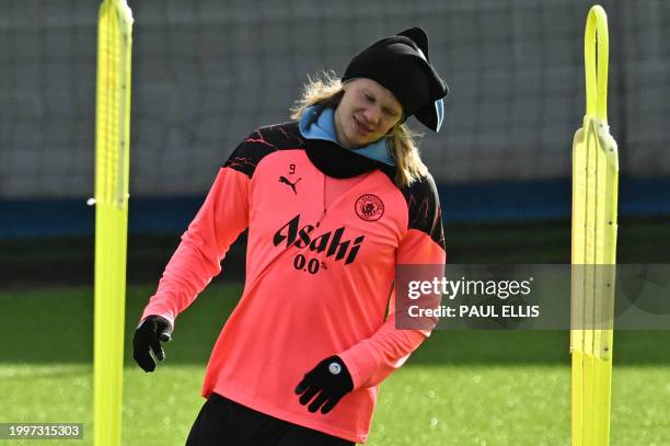 Manchester City's Norwegian striker Erling Haaland attends a training session at Manchester City's training ground in north-west England on February...