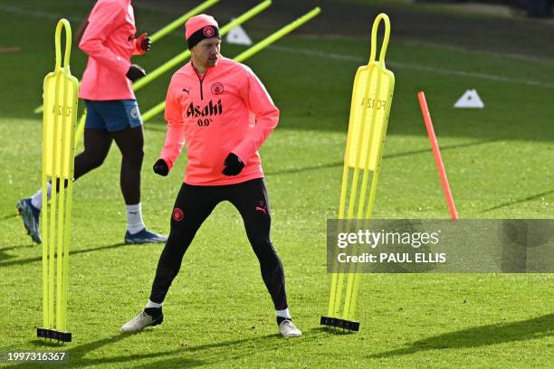 Manchester City's Belgian midfielder Kevin De Bruyne attends a training session at Manchester City's training ground in north-west England on...