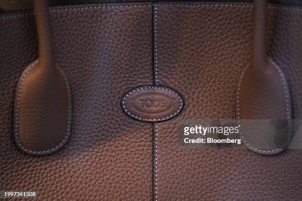 Logo on a leather bag at a Tod's SpA luxury boutique in central Paris, France, on Monday, Feb. 12, 2024. The founding family of Tod's is teaming up...