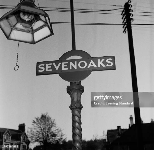 Sevenoaks railway station sign and light fixture, Kent, November 19th 1956.