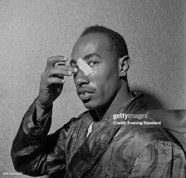 West Indies cricketer Alf Valentine shows a plaster on his nose after being injured in the Fifth Test against England in Britain, August 23rd 1957.