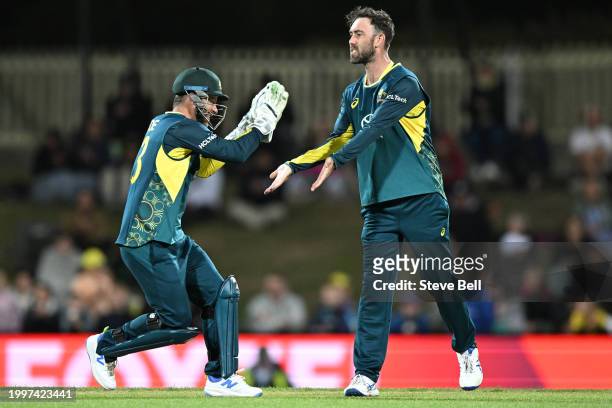 Glenn Maxwell of Australia celebrates the wicket of Rovman Powell of the West Indies during game one of the Men's T20 International series between...