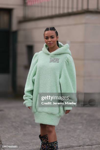 Aminata Belli seen wearing Marina Hoermanseder pastel green pearl embroidered logo teddy fur oversized hoodie / sweater dress, Buffalo x Marina...