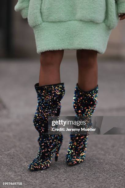 Aminata Belli seen wearing Marina Hoermanseder pastel green pearl embroidered logo teddy fur oversized hoodie / sweater dress and Buffalo x Marina...