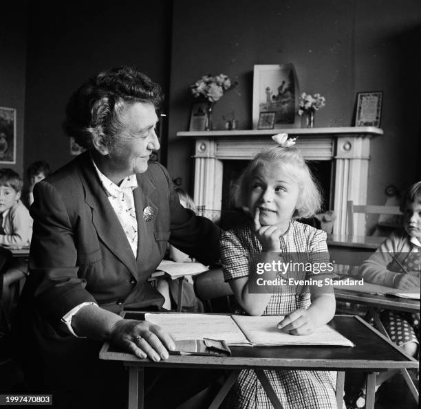 Teacher and pupil during a class at Rupert House School, Henley-on-Thames, Oxfordshire, June 20th 1957.