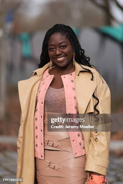 Lois Opoku seen wearing colorful diamond earrings, Marina Hoermanseder light pink shimmery knit top, Marina Hoermanseder light pink quilted short...