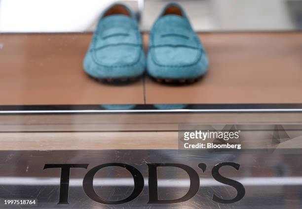 Suede loafers in the window of a Tod's SpA luxury boutique in central Paris, France, on Monday, Feb. 12, 2024. The founding family of Tod's is...