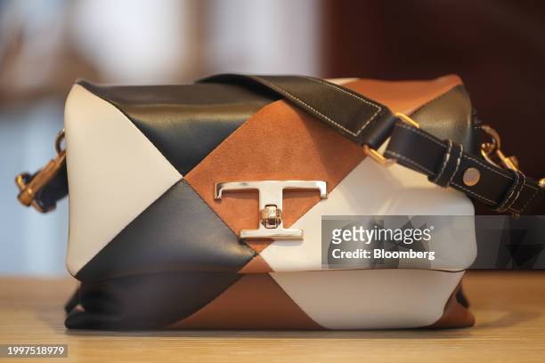 Timeless Flap bag in the window of a Tod's SpA luxury boutique in central Paris, France, on Monday, Feb. 12, 2024. The founding family of Tod's is...