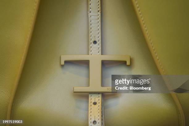 Logo on the fastening of a leather bag in the window of a Tod's SpA luxury boutique in central Paris, France, on Monday, Feb. 12, 2024. The founding...