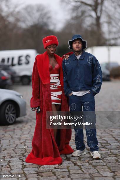 Toni Dreher seen wearing Marina Hoermanseder red belted fake fur fluffy hat, Marina Hoermanseder red / white leather striped belted corset short...