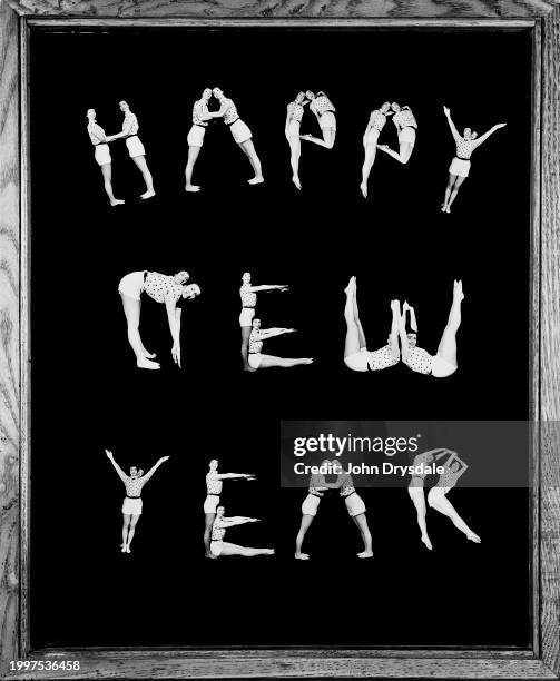 Collage of individual letters formed by twins Pamela and Pauline Chamberlain, from Leytonstone in London, to make the words 'Happy New Year',...