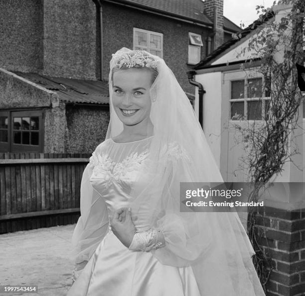 Actress Shirley Eaton wearing her wedding dress on her wedding day, Kenton, London, August 5th 1957.