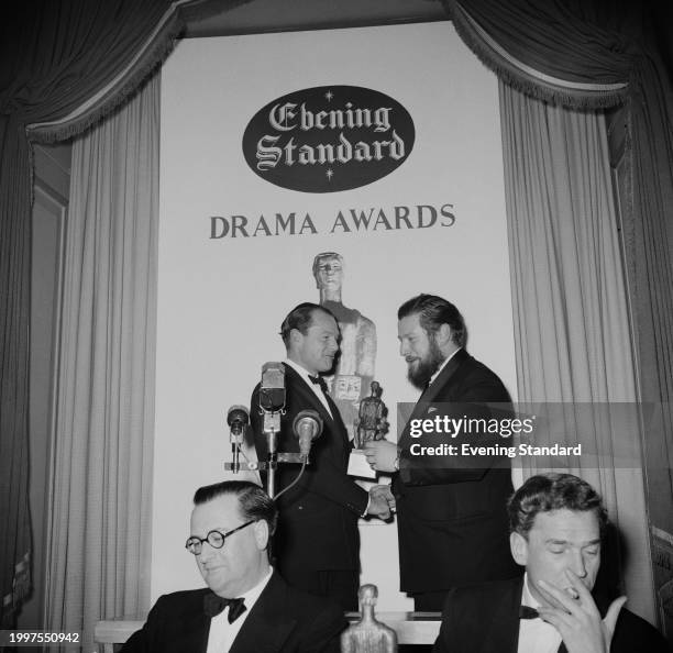 Actor Peter Ustinov receives his award for Best Play from director of the Express Group, Max Aitken at the Evening Standard Drama Awards, London,...