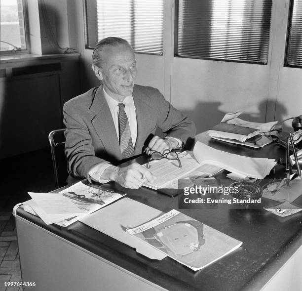 Car designer Alec Issigonis in his office at the BMC Austin Longbridge car plant, Birmingham, June 26th 1957.