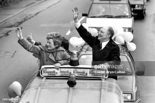Married couple, Leader of the Labour Party Neil Kinnock and Glenys Kinnock , wave from a motorcade as they tour his Islwyn constituency during the...