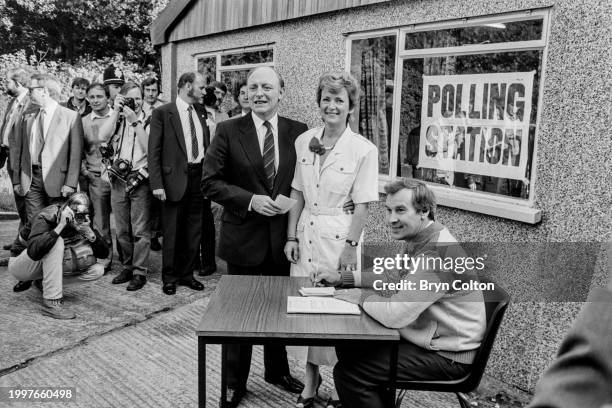 Married couple, Leader of the Labour Party Neil Kinnock and Glenys Kinnock , collect their ballot papers at the polling station on election day for...