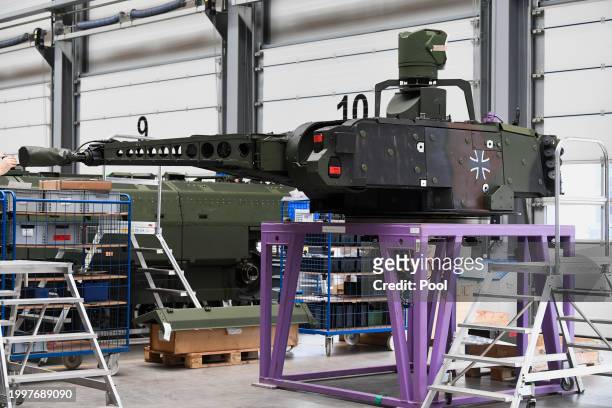 An view of a Puma fighting vehicle's cannon at a production line as German Chancellor Olaf Scholz and Defence Minister Boris Pistorius attend the...