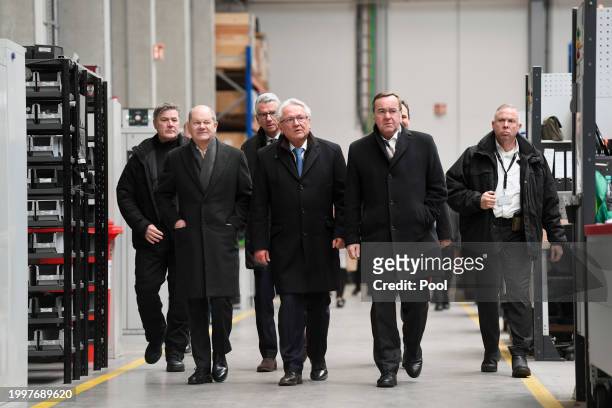 German Chancellor Olaf Scholz, German Defence Minister Boris Pistorius and CEO of Rheinmetall Armin Papperger visit a production line during the...