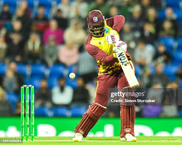 Romario Shepherd of the West Indies drives through the coversduring game one of the Men's T20 International series between Australia and West Indies...