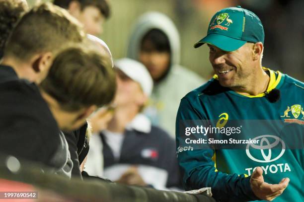 David Warner of Australia is seen with fans during game one of the Men's T20 International series between Australia and West Indies at Blundstone...