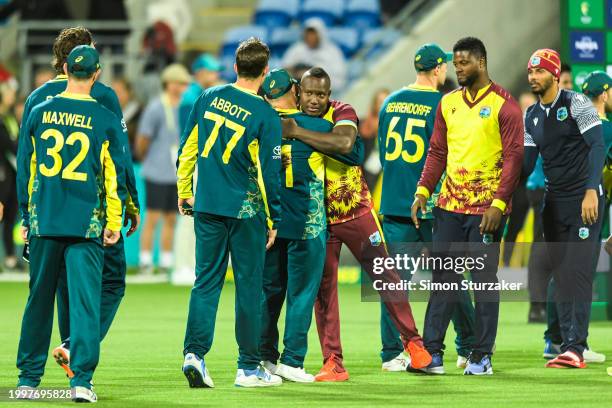 Both teams embrace after game one of the Men's T20 International series between Australia and West Indies at Blundstone Arena on February 09, 2024 in...