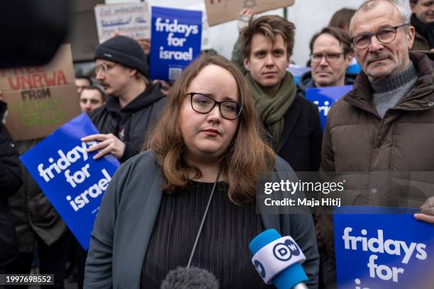 Germany's Greens party co-leader Ricarda Lang speaks to the media as she attends a protest at the Free University Berlin to show solidarity with...