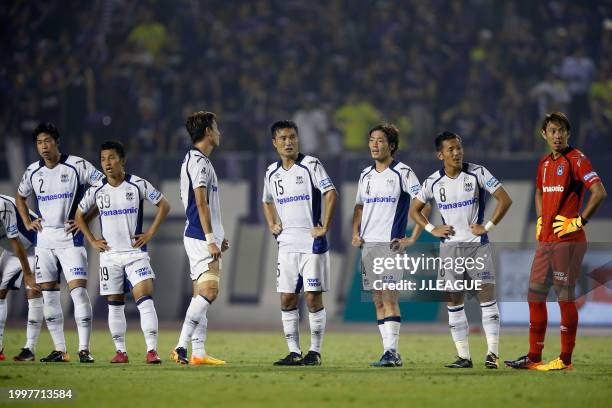 Gamba Osaka players react after the 2-2 draw in the J.League J1 match between Sanfrecce Hiroshima and Gamba Osaka at Edion Stadium Hiroshima on...