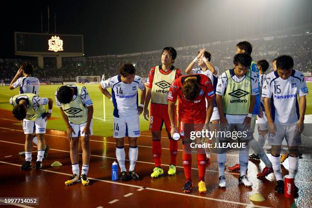 Gamba Osaka players applaud fans after the 2-2 draw in the J.League J1 match between Sanfrecce Hiroshima and Gamba Osaka at Edion Stadium Hiroshima...